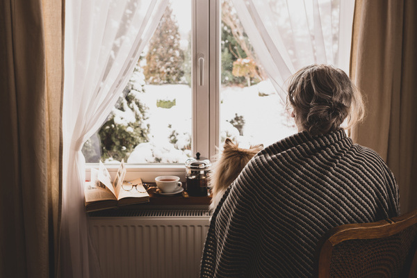 Old retired woman (senior) by the home window - retirement concept | Pension de reversion
